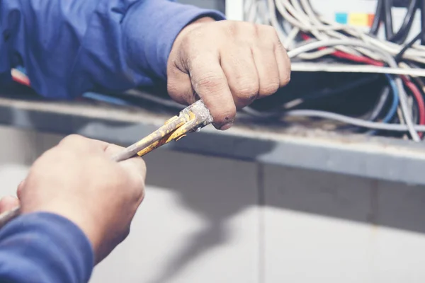 Electrician performing wiring work